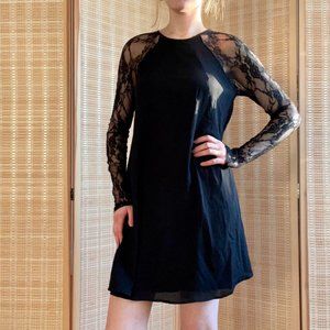 Elegant black shift dress with lace sleeves